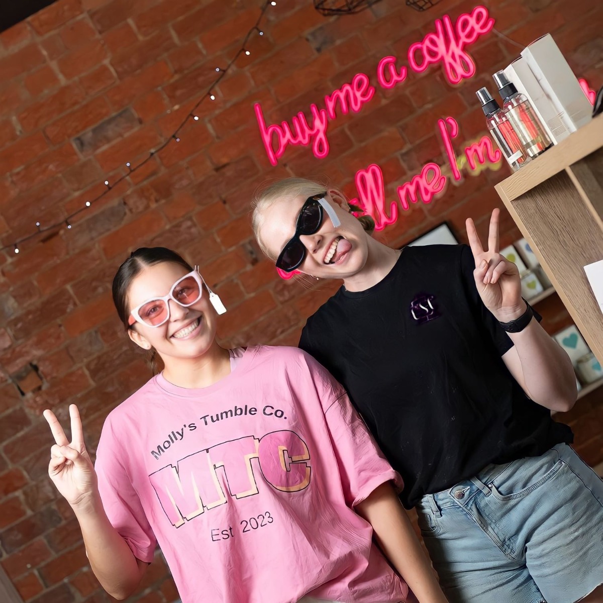 Buy me a coffee and tell me I'm pretty Custom Neon® selfie backdrop sign in pink on red brick wall @csc_dubbo