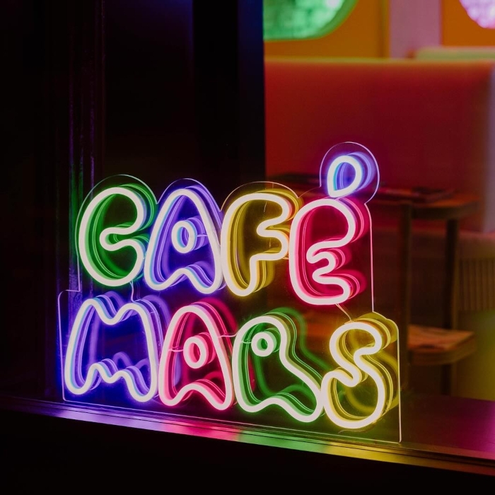 Colorful Custom Neon® cafe name sign in the window of @cafemarsbk