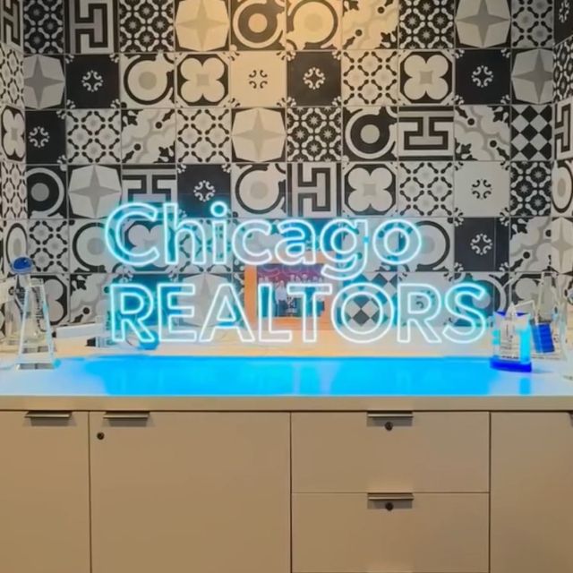 Chicago REALTORS custom LED neon sign lighting up a modern office counter