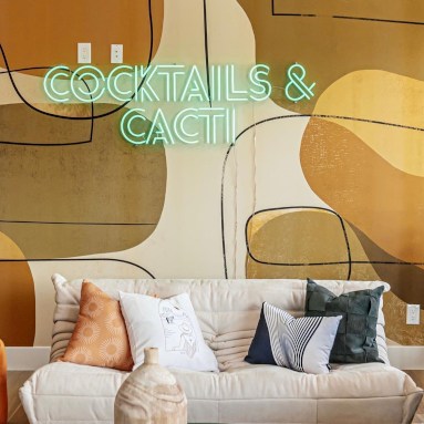 Cocktails and Cacti green double lined Custom Neon® sign on pebble wallpaper in an Airbnb designed by @somerled.designs