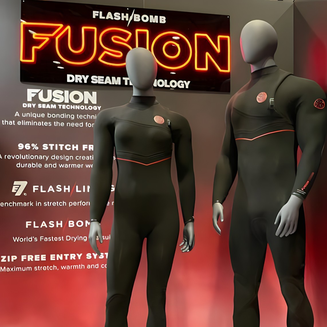 Custom Neon® Fusion sign in red LED neon on a shiny black acrylic backing behind manikins dressed in Rip Curl wetsuits