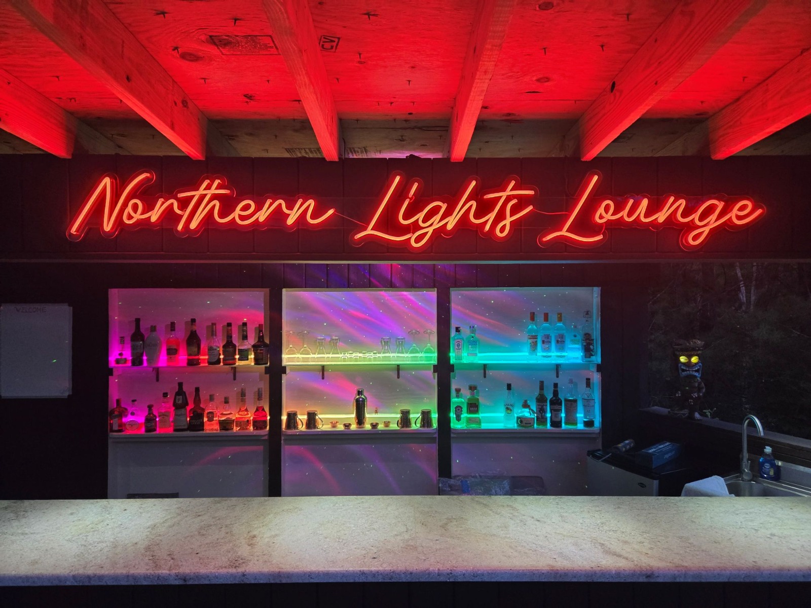 Northern Lights Lounge Custom Neon® color changing outdoor bar sign set to red