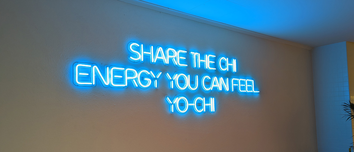 Large blue branded wall sign by Custom Neon&reg; sign @iloveyochi