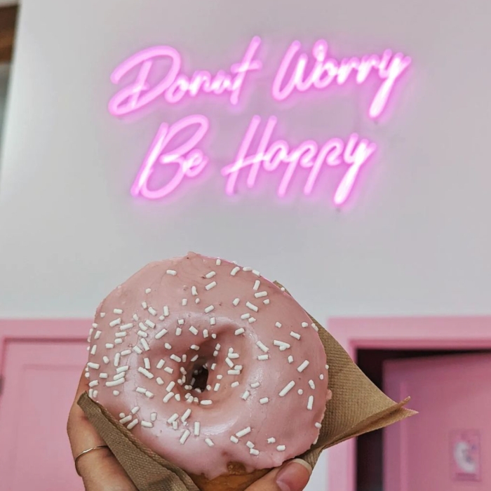 Pink Custom Neon® bakery quote sign @doughjoydoughnuts