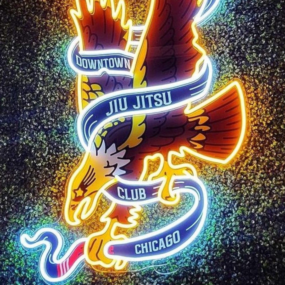 Emblem logo sign made by Custom Neon® featuring graphics and text @downtownjiujitsuclubchicago