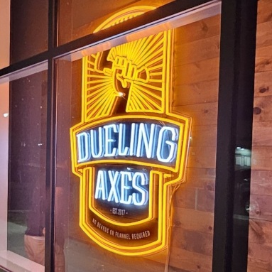 Storefront window logo sign by Custom Neon® @duelingaxes