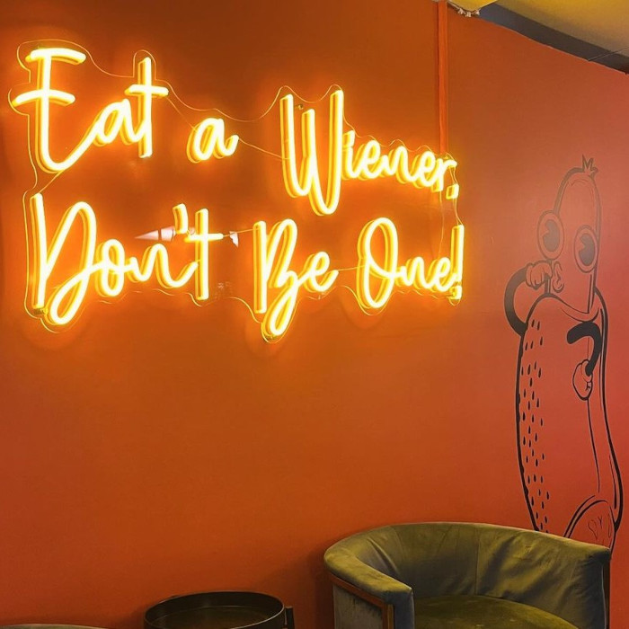 Yellow eat a weiner don't be one! Custom Neon® selfie wall sign @shortleashhotdogs