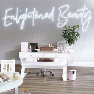 White beauty salon business name sign by Custom Neon® @enlightenedbeauty