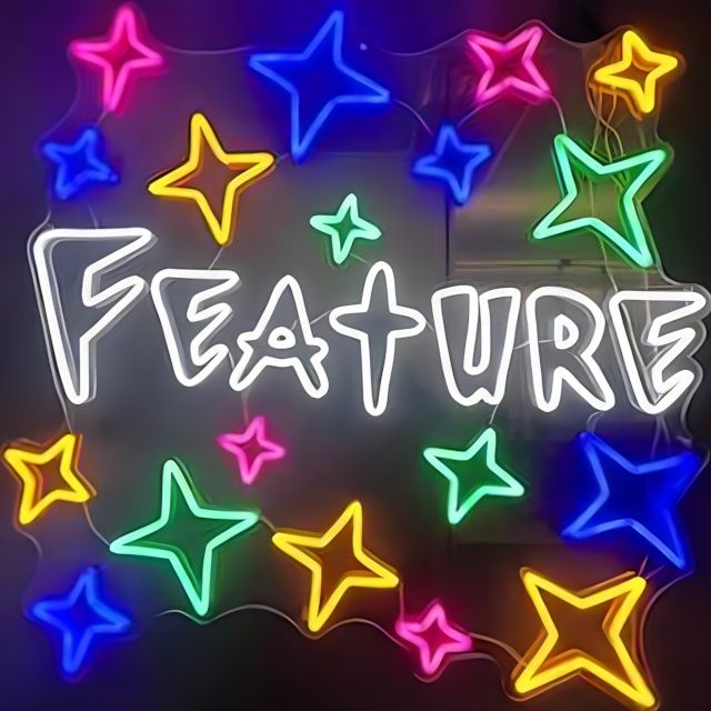 Mulicolor Custom Neon® wall display of stars with Feature written in white LED neon