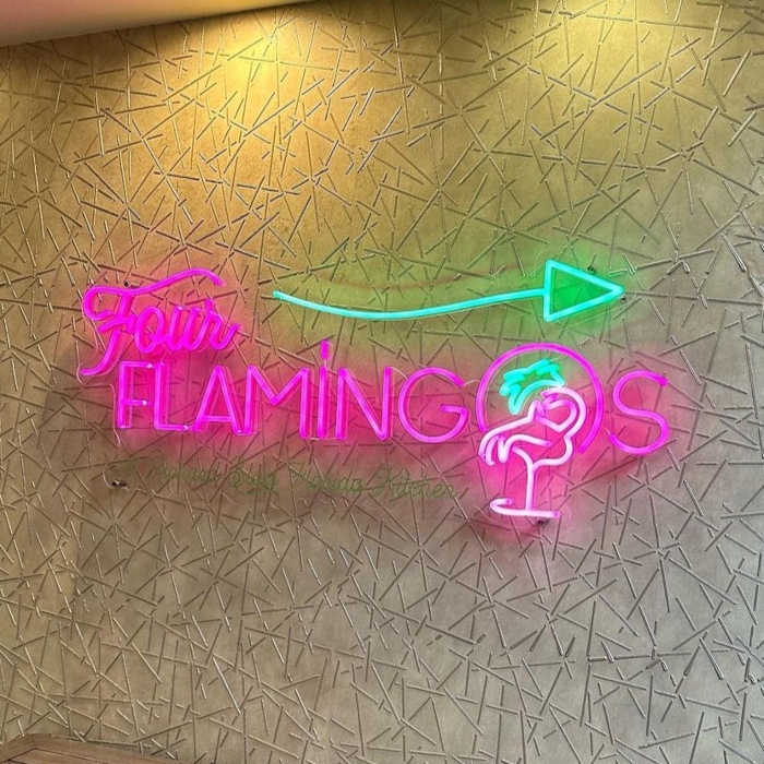Multicolored Orlando restaurant logo sign by Custom Neon® @fourflamingosorl