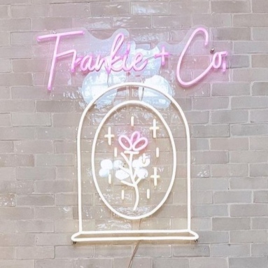 Warm white and pink Milwaukee hair salon Custom Neon® sign @frankieandco.salon