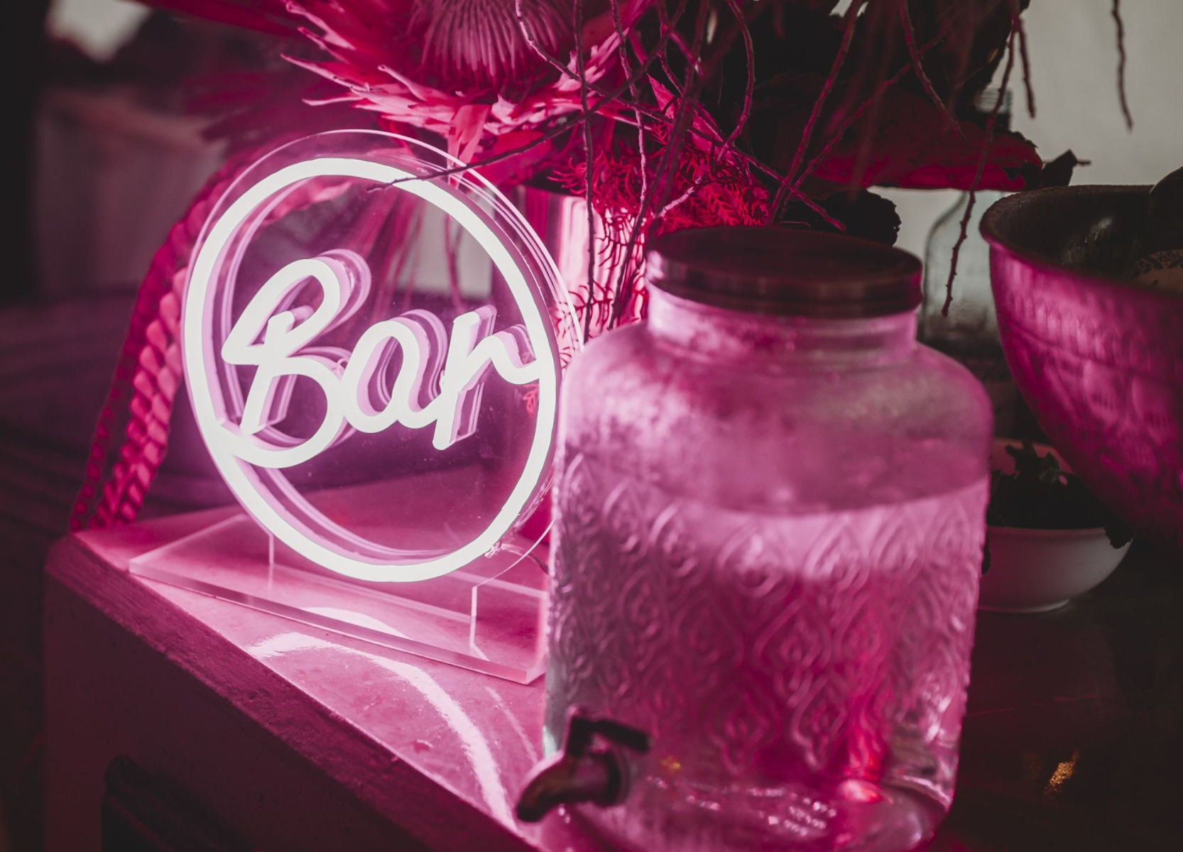 Custom Neon® pink bar sign on acrylic stand