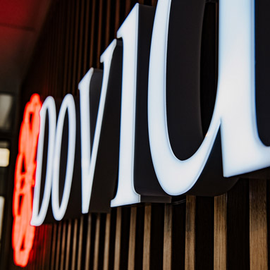 Front lit interior business name sign with LED Neon logo