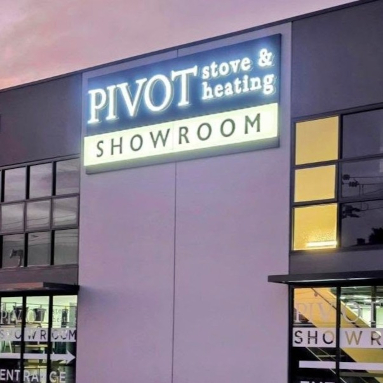 Front lit exterior building sign above the door to the Pivot Stove and Heating showroom