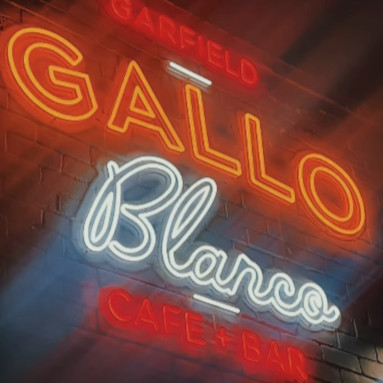 Custom Neon® IP67 waterproof sign reading Gallo Blanco Cafe + Bar on the building exterior @galloblancocafe