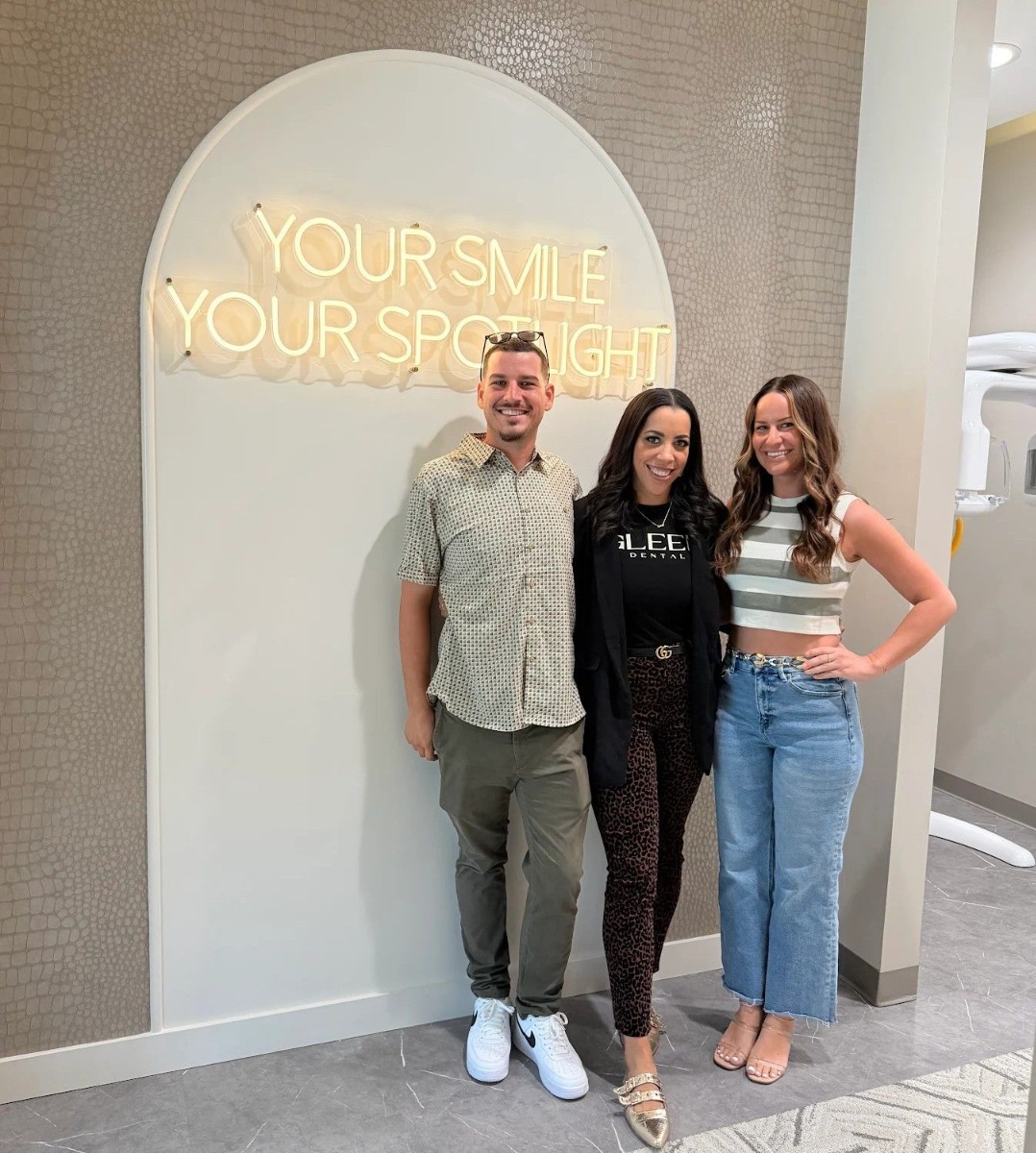 Your Smile Your Spotlight warm white Custom Neon® photo wall sign @gleemdental