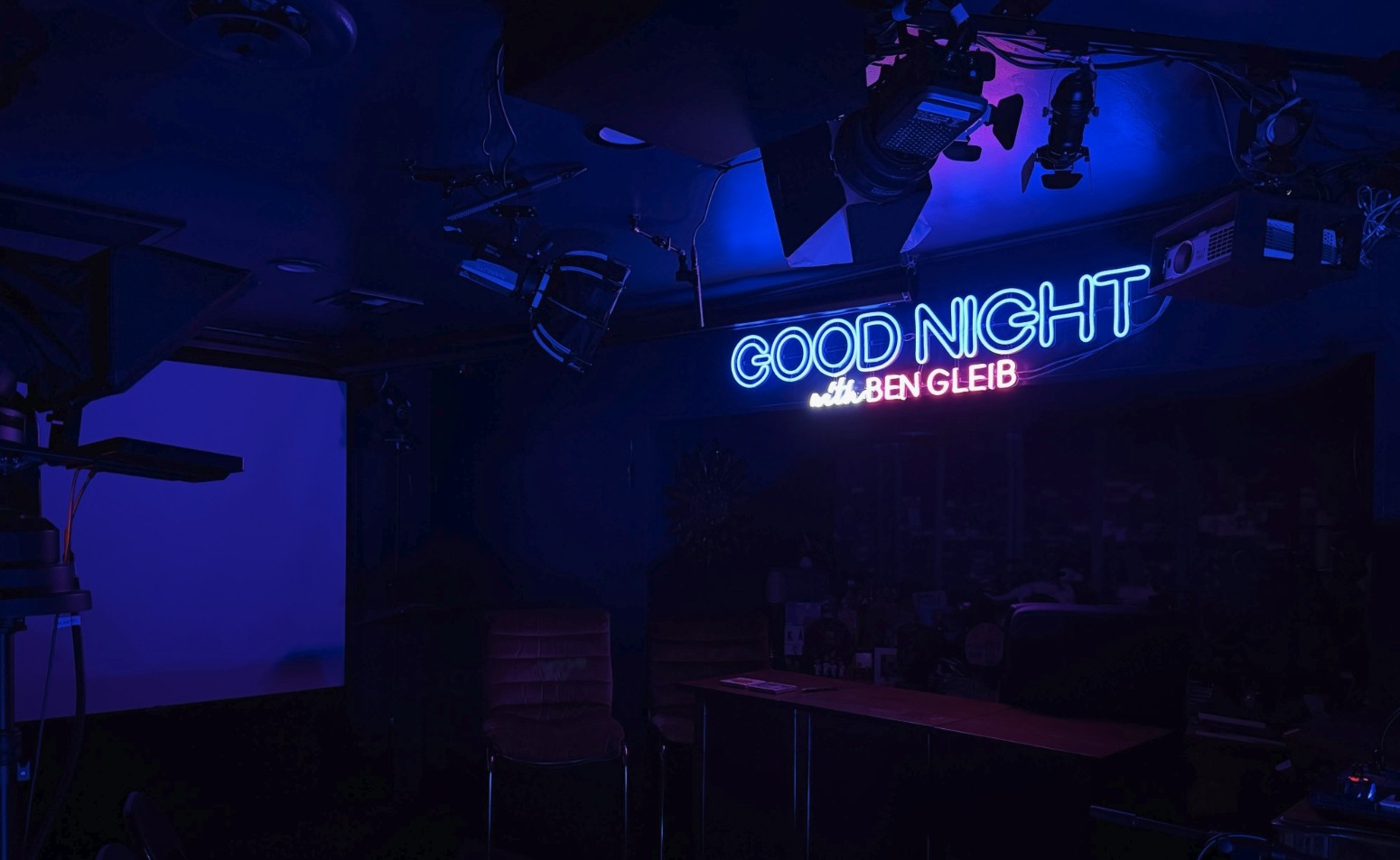 Blue and pink Custom Neon® backdrop sign for the Goodnight with Ben Gleib YouTube comedy show