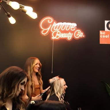 Custom Neon® LED neon UV print conference sign on grass wall @villanovahrd @shrmofficial