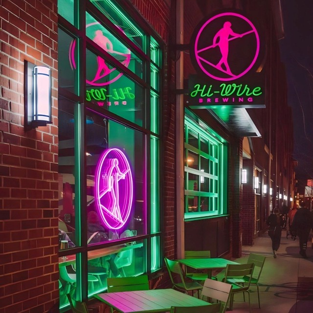 Custom Neon® pink @hiwirebrewing logo in the front window @hiwirebrewing_clt