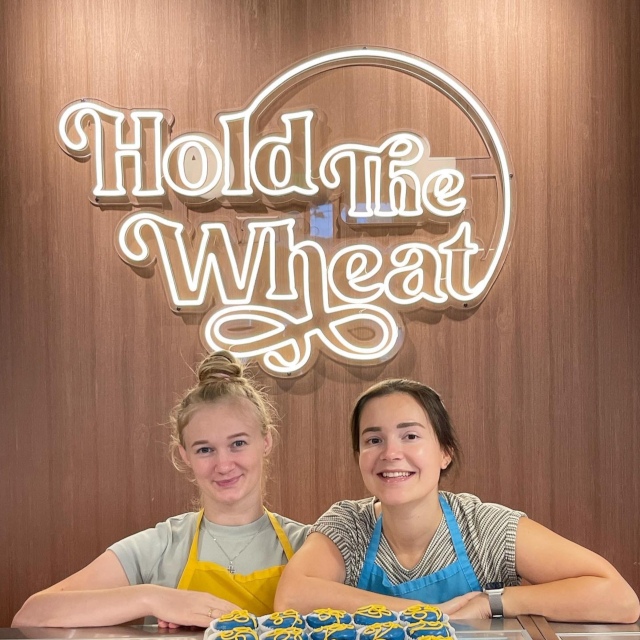 Warm white Custom Neon® bakery logo sign @holdthewheatgf