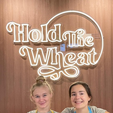 Warm white Custom Neon® bakery logo sign @holdthewheatgf