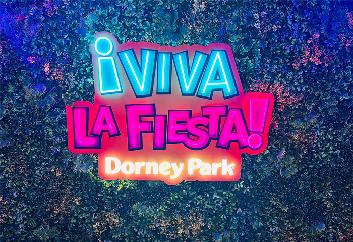 Colorful LED neon ice cream store sign with UV printing infills on a blue wall