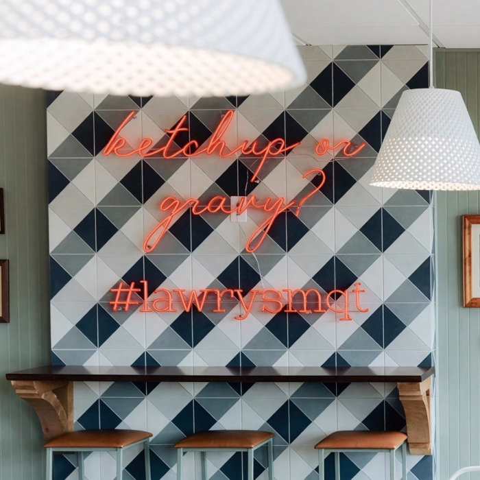 Red hashtag sign by Custom Neon® on checkered wall @curiodesignstudio