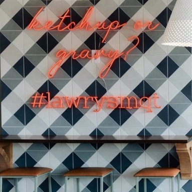 Red hashtag sign by Custom Neon® on checkered wall @curiodesignstudio
