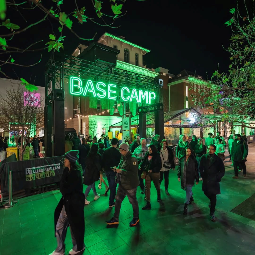LED exterior signage by Custom Neon® on a busy city street at night