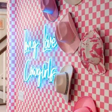 Happiest Vacay on Earth large white Custom Neon® sign in an Airbnb decorated by @somerled.designs