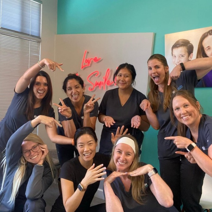 Light red love my smile Custom Neon® selfie wall sign @mysmileorthosd