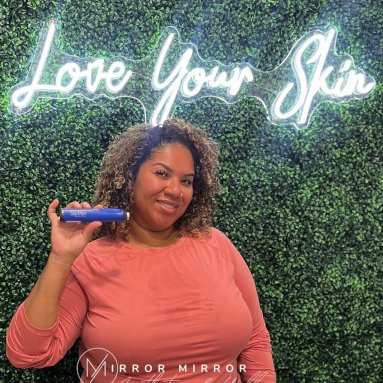 San Antonio Lip Plug red Custom Neon® selfie sign on a grasswall @injectionroom