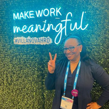 Custom Neon® LED neon UV print conference sign on grass wall @villanovahrd @shrmofficial