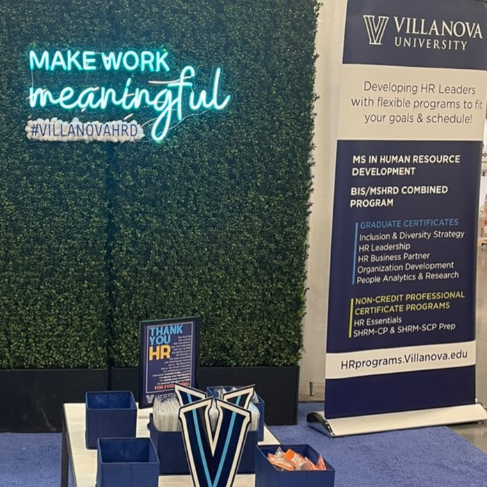 Custom Neon® LED neon UV print conference sign on grass wall @villanovahrd @shrmofficial