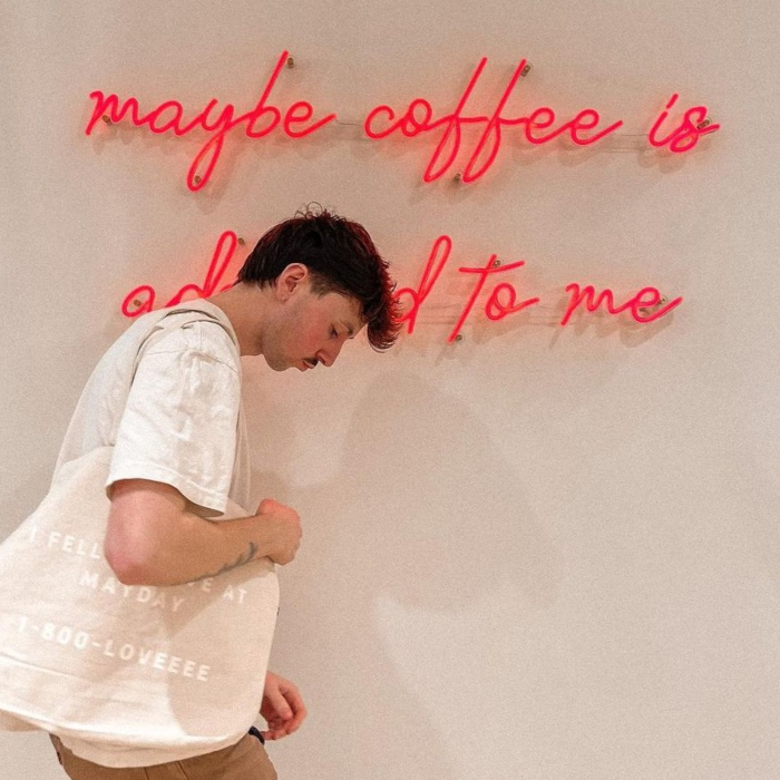 Red Custom Neon® selfie wall sign reading maybe coffee is addicted to me @maydaycoffeeshop