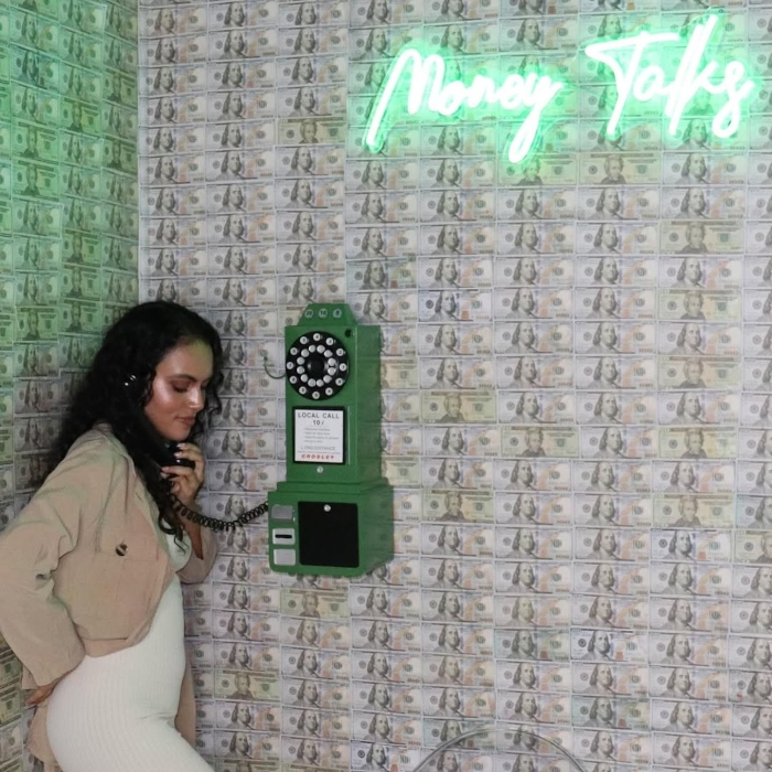 Money Talks green LED Custom Neon® sign in selfie booth designed by @selfieboxsacramento featuring thavashni_ramdin