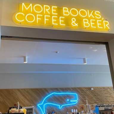 Blue whale neon sign and yellow more books, coffee & beer Custom Neon® retail sign @whitewhalebks