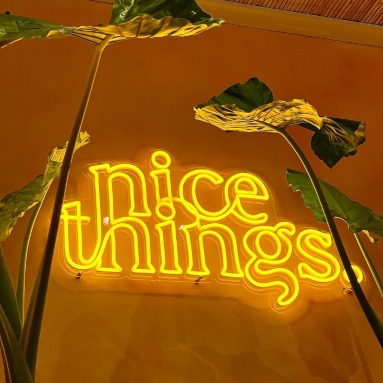 Golden yellow Nice Things retail store sign by Custom Neon®