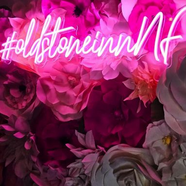 theoldstoneinnnf Custom Neon® pink hashtag sign on a rose wall at The Old Stone Inn in Niagara Falls @oldstoneinnnf