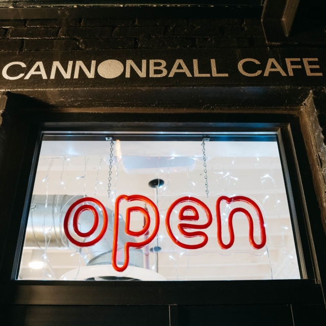 Red Custom Neon® cafe Open sign in front window @cannonballcafebos