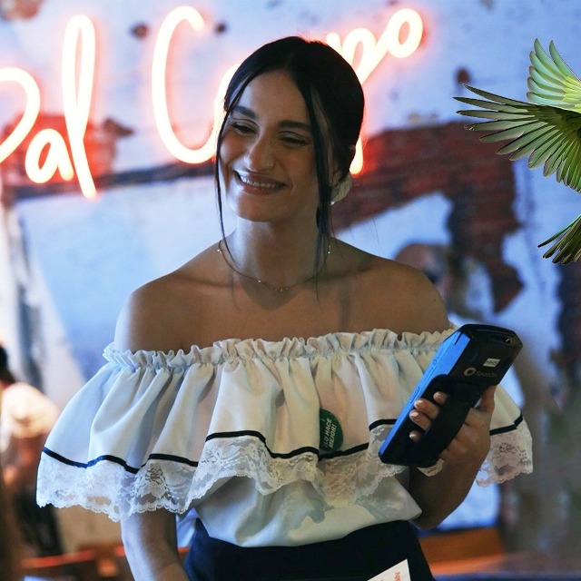 Orange Pal Campo Custom Neon® restaurant sign on the wall behind the waitress @palcamporestaurant  Orlando Florida