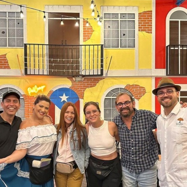 Orange Pal Campo Custom Neon® restaurant sign on a colorful facade inside the Puerto Rican  @palcamporestaurant in Orlando