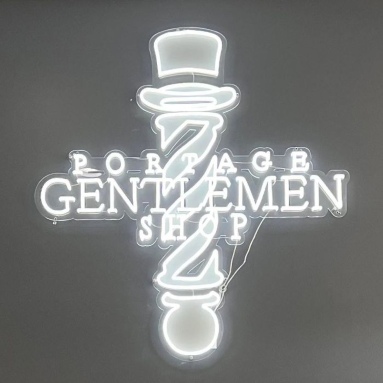 Portage Gentlemen Shop Custom Neon® sign shaped like a barber pole with a top hat
