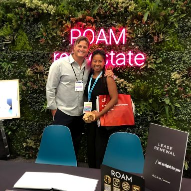 Pink roam real estate Custom Neon® green wall logo sign @roamcommercialrealty 