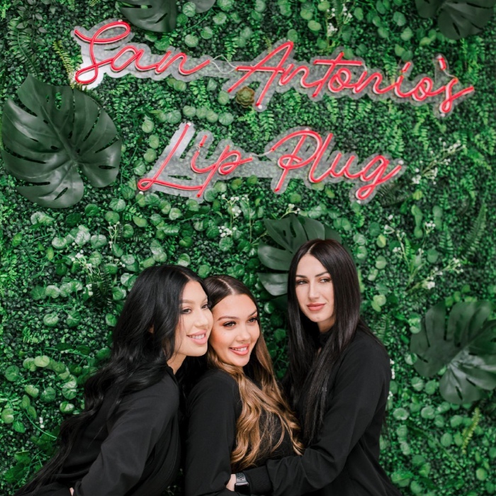 Red Custom Neon® beauty salon quote sign on a grass wall @injectionroom