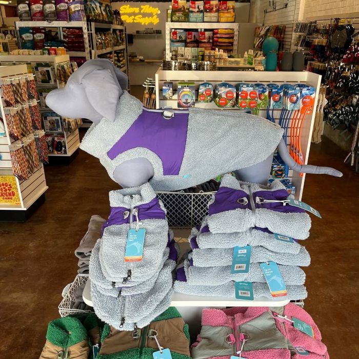 Yellow Custom Neon® store name sign on the back wall of a pet supply store @shorethingpetsupply