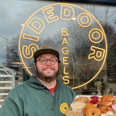 Custom Neon® logo sign in the window @sidebarbagel