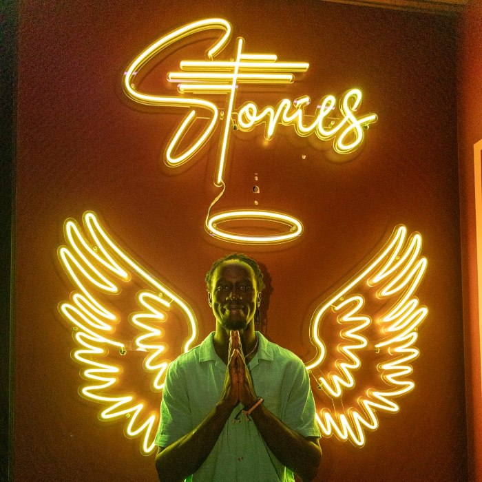 RGB color changing @stories.au branded angel wings Insta wall sign made by Custom Neon®
