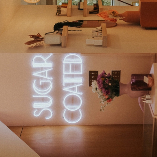 White Custom Neon® wax studio name sign @sugarcoated