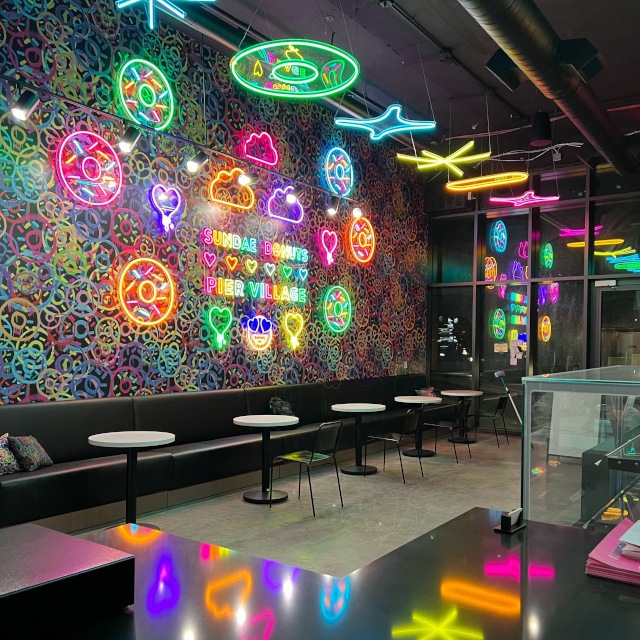 Multicolored Custom Neon® wall art installation and ceiling signs @sundaedonuts